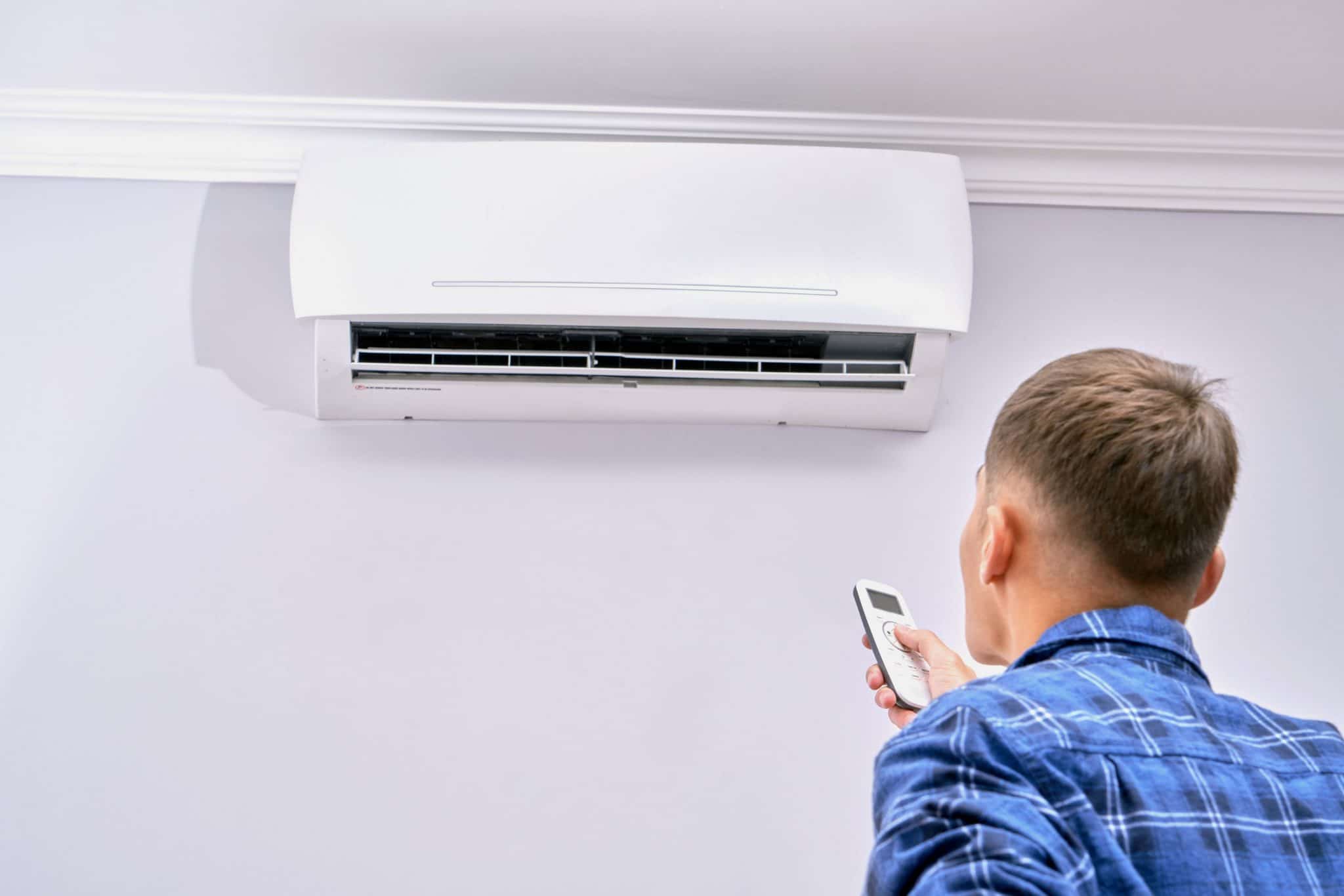 homeowner operating a ductless air conditioner