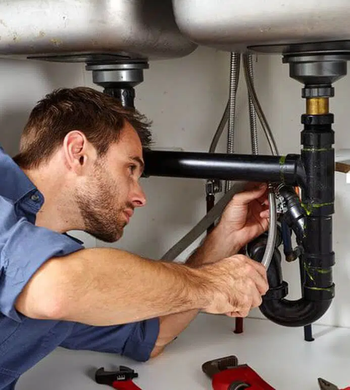 technician handling a plumbing emergency