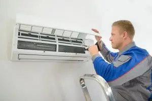 technician installing a ductless air conditioner