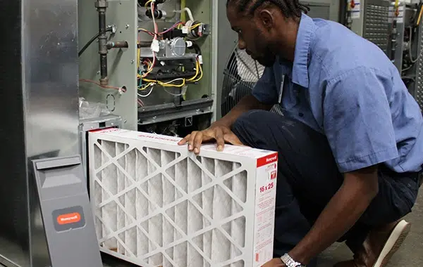 technician performing furnace tune-up